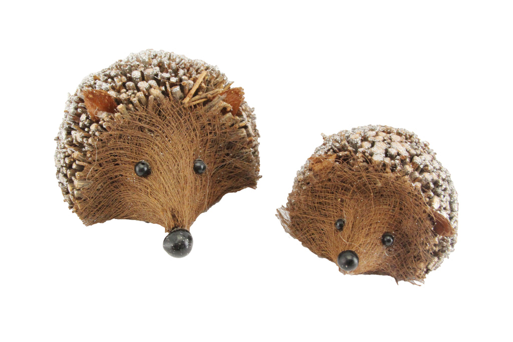 Hedgehog shaped christmas decoration made from twigs with glitter snow.